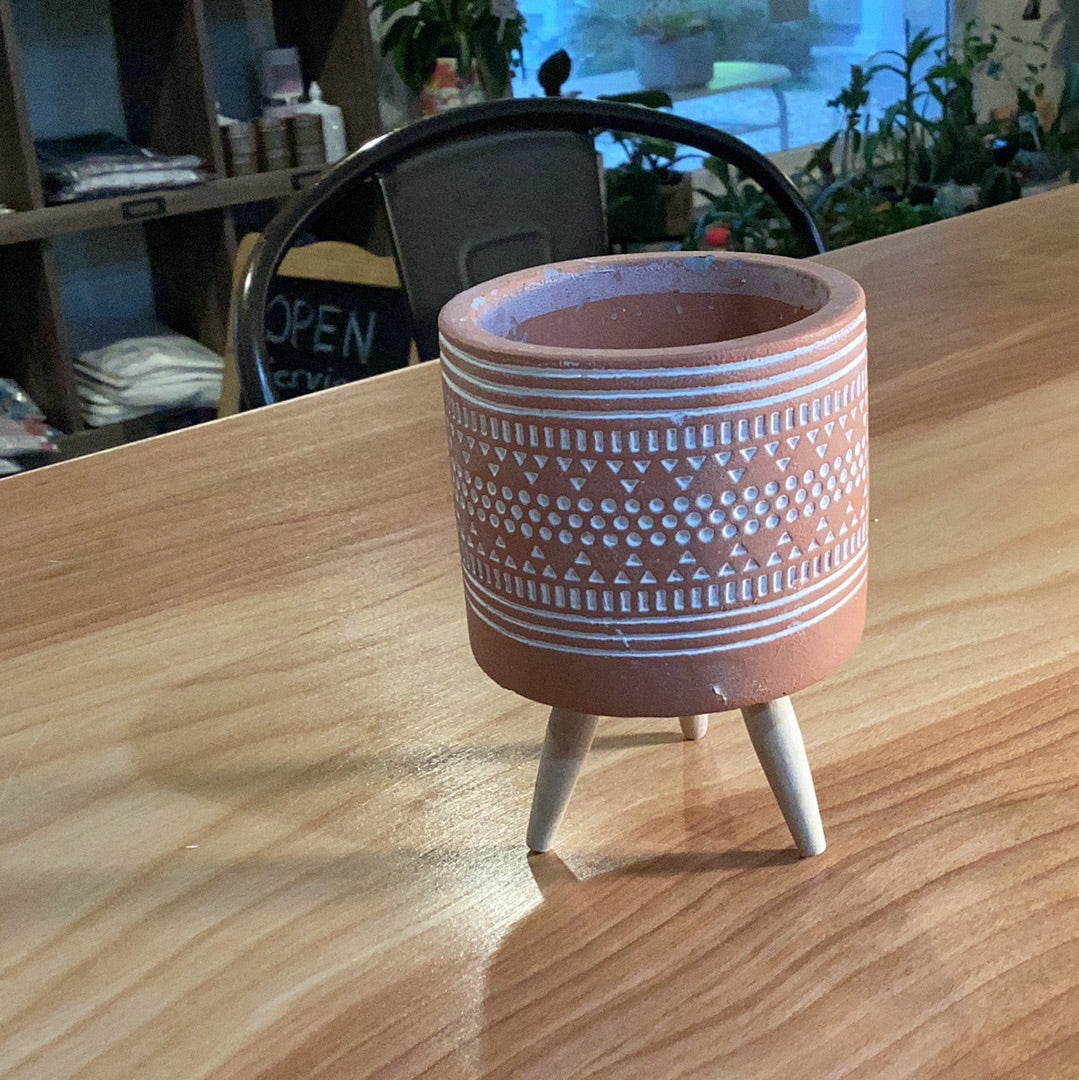 Tribal planter on wooden legs